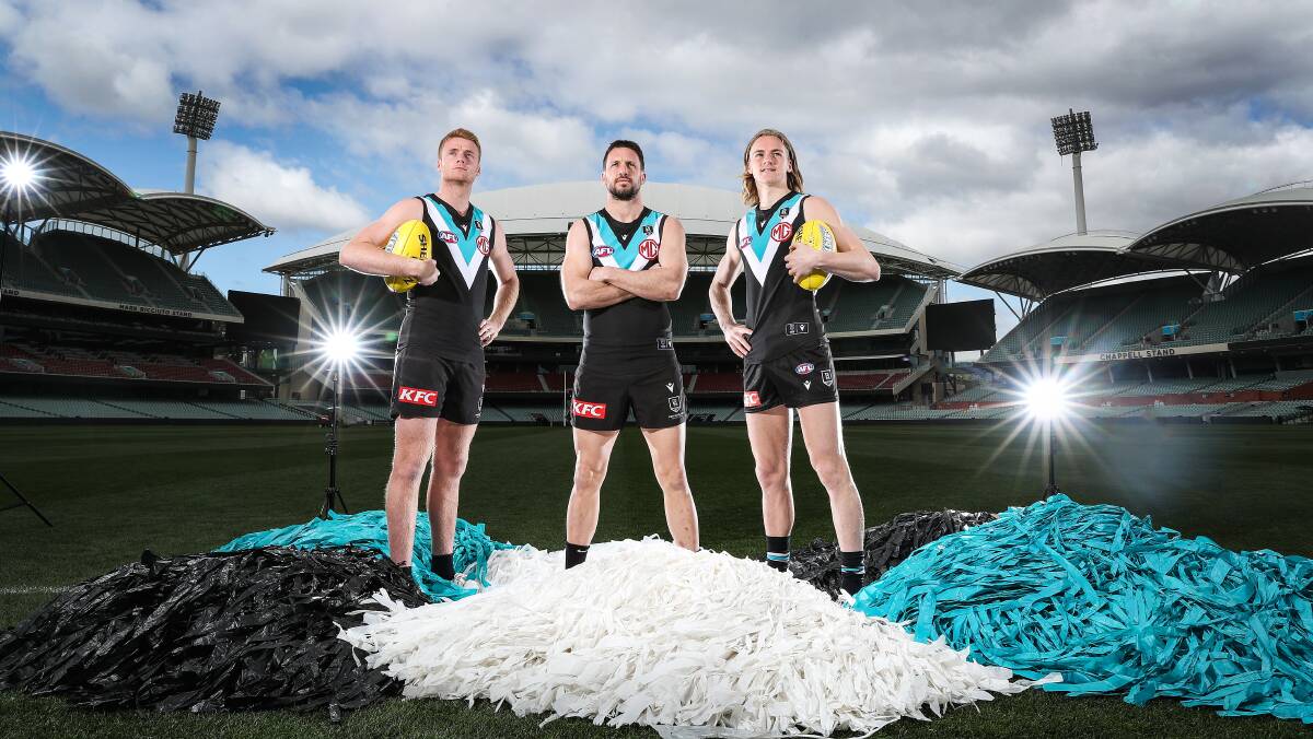 LIGHTING IT UP: Willem Drew, Travis Boak and Miles Bergman want to take Port Adelaide to the AFL grand final. Picture: Getty Images 