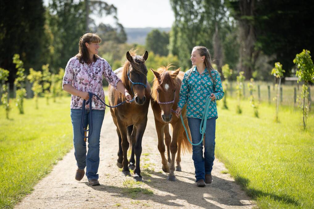 Carly and Asha Loughnan with their brumbies - Pirate and Dawn - at their Timboon home. Picture by Sean McKenna 