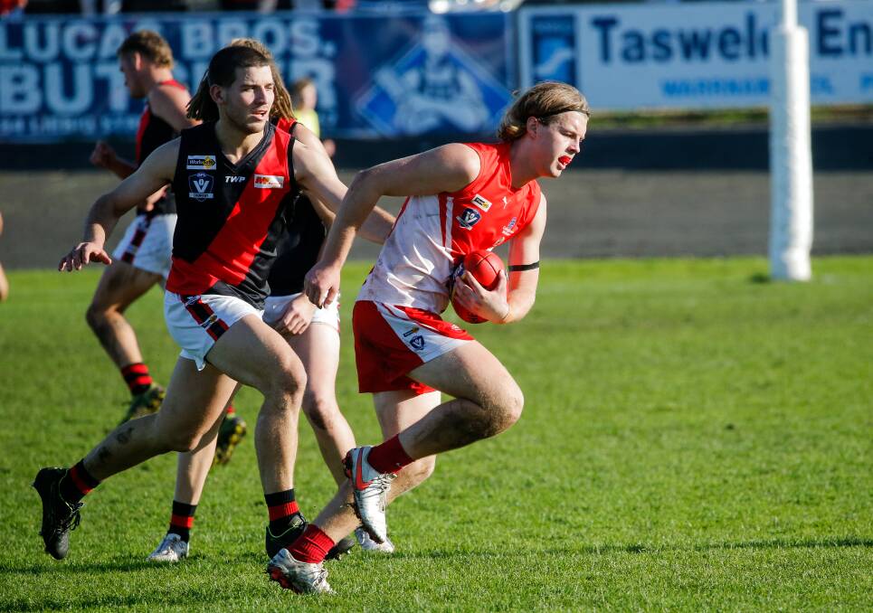 GAME ONE: Thomas Freitag bursts away with the ball on debut for South Warrnambool on Saturday. Picture: Anthony Brady 