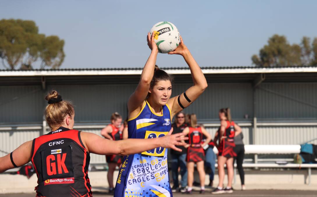 SEARCHING FOR OPTIONS: North Warrnambool Eagles' Victoria Grundy looks to pass against Cobden on Saturday. Picture: Justine McCullagh-Beasy