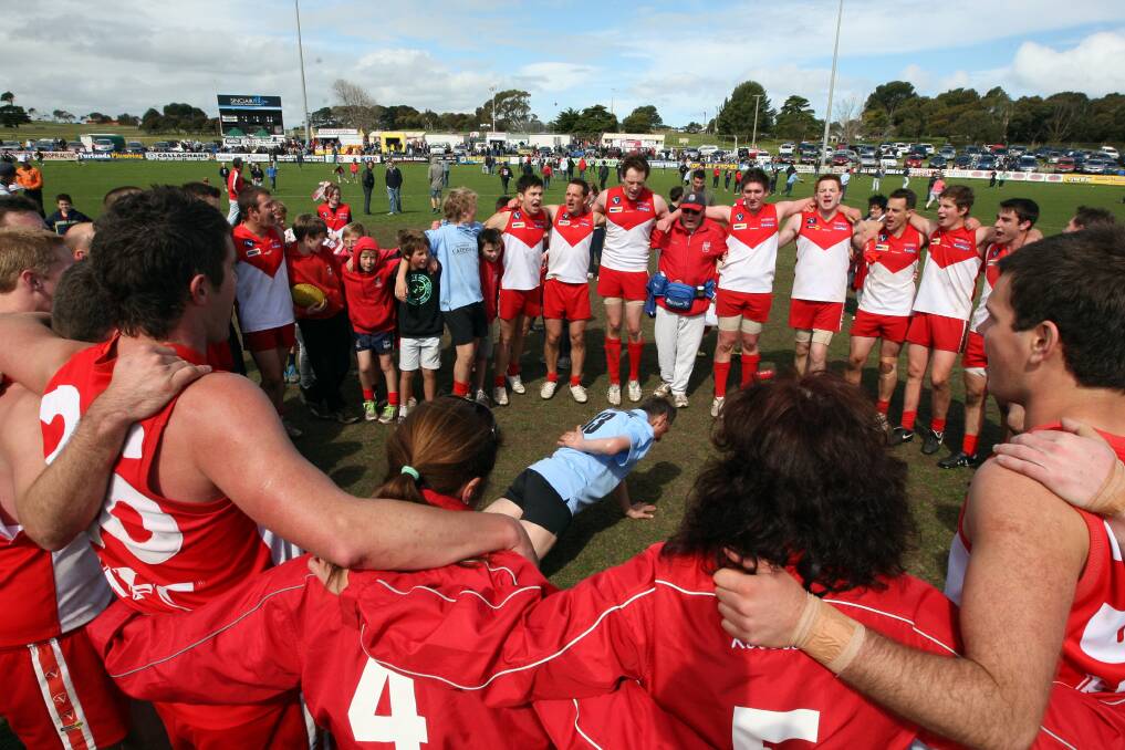 2011: Johnny De Grandi doing his famous one-handed push-ups after South Warrnambool won the reserves flag.