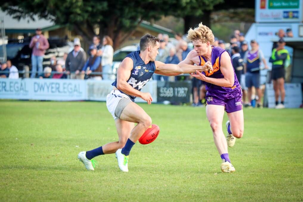 Warrnambool's Luke Cody and Port Fairy's Ollie Myers tussle on the wing. Picture by Justine McCullagh-Beasy 