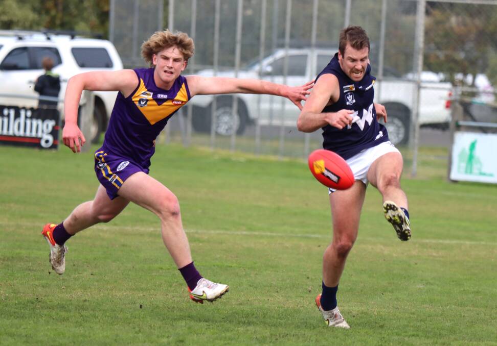 OUT OF REACH: Port Fairy's Ollie Myers tries to catch Warrnambool's Damien McCorkell. Picture: Justine McCullagh-Beasy 