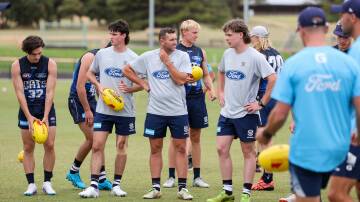 Warrnambool's Ethan Boyd, Mitch Bidmade and Reggie Mast immerse themselves in Geelong training. Picture by Anthony Brady 
