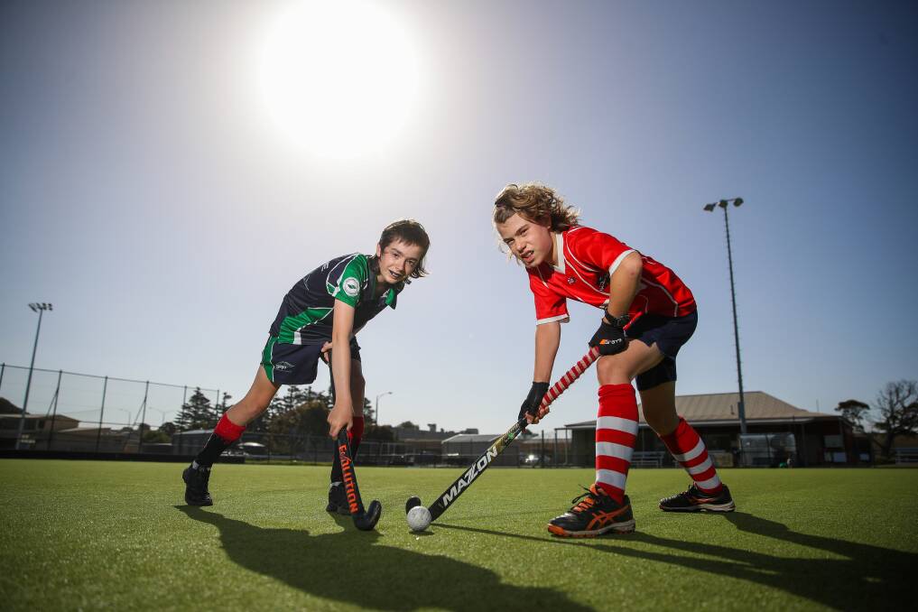 GAME ON: Warrnambool and District Hockey Association's Archie Pickett, 12, and Remy Boote, 11, at training on Thursday night. They could feature in the Great South Coast Hockey Challenge next month. Picture: Morgan Hancock