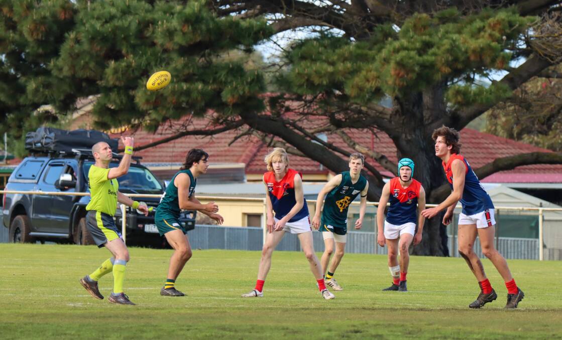 Old Collegians and Timboon Demons contest a centre bounce during their WDFNL under 18 match on Saturday. Picture by Justine McCullagh-Beasy 