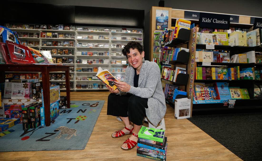 READING SUGGESTIONS: Collins Booksellers' Sally Jane with some of the store's recommended reads. Picture: Anthony Brady 