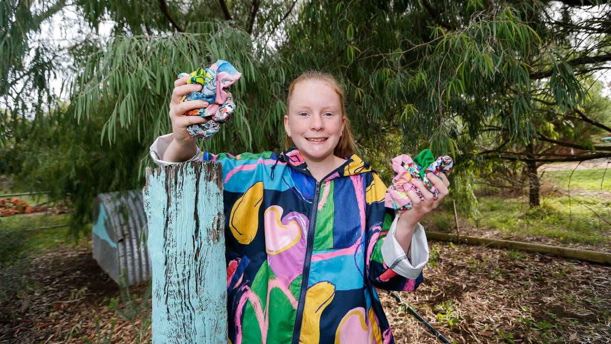 GOALS: Koroit's Bailey MacDonald with some of her Gorman scrunchies she is making in the hopes of raising $10,000 for South West Cancer Centre. Picture: Anthony Brady

