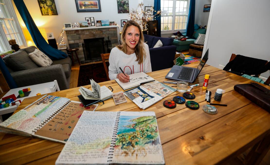 Caroline Healey with an array of her sketchbooks. Picture: Anthony Brady.