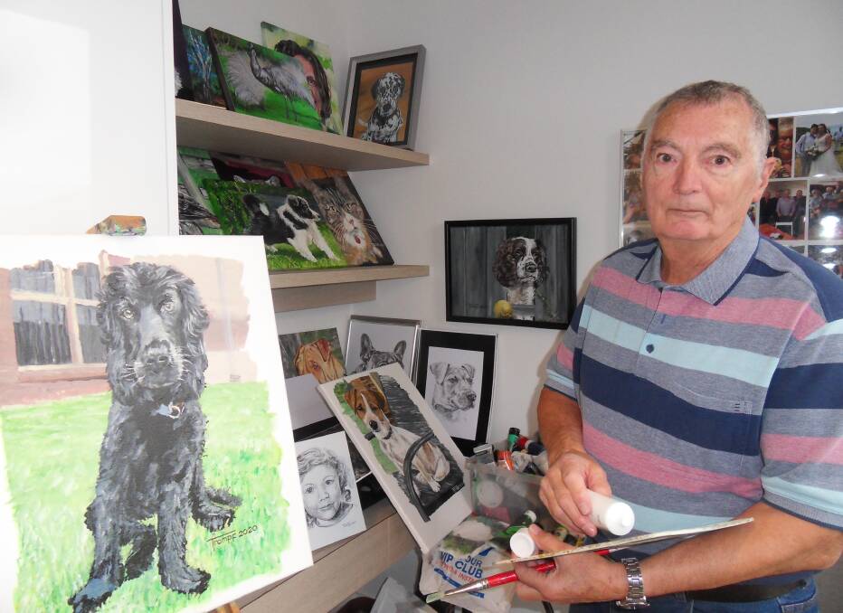 MUSE: Malcolm Trompf in his studio with some of his pet portraits. 