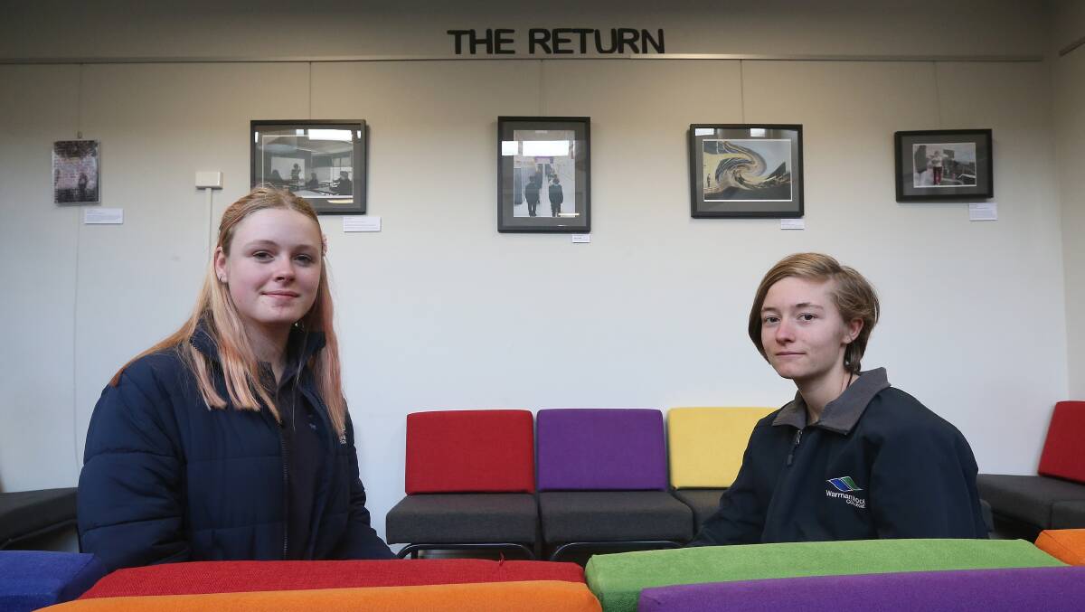 EXHIBITION: Warrnambool College year 10 students Olive Adams, 14, and Tiarni Belazs, 15, at their coronavirus-inspired exhibition in the school's gallery. Picture: Mark Witte