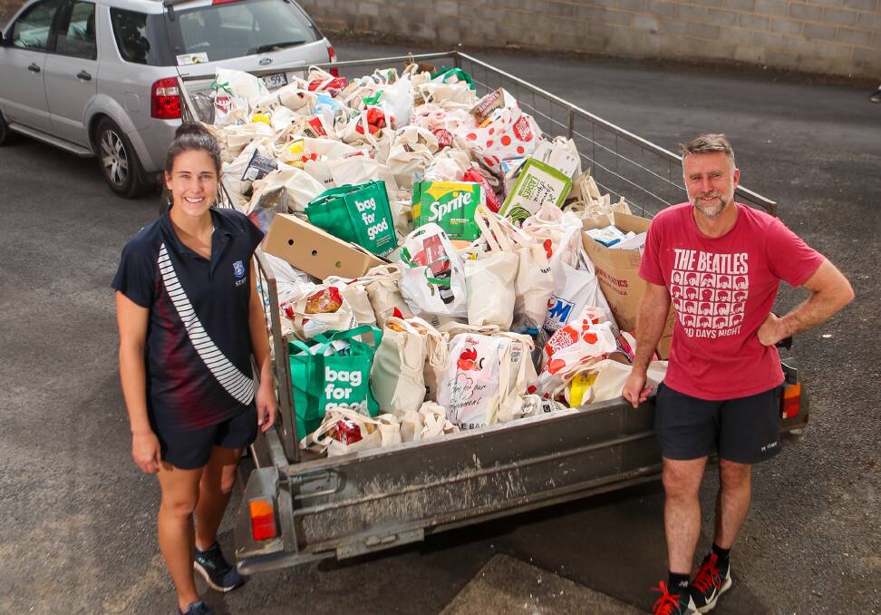 EFFORT: Melody Keath and Matt Jellie with The Warrnambool Baptist Church food drive collections which will be donated to Warrnambool Foodshare. Picture: Morgan Hancock