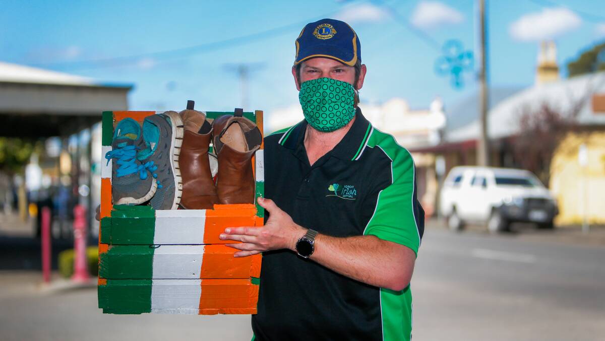 TREASURE HUNT: Koroit Lions Club treasurer and Irish Festival committee member Blake Allen with one of the treasure boxes lining Commercial Road. Picture: Anthony Brady. 