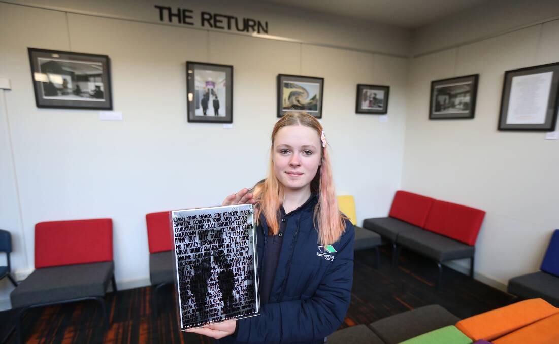 TEAMWORK: Year 10 art student Olive Adams, 14, was part of the art class who joined forces with the humanities students and English department to created the visual exhibition.