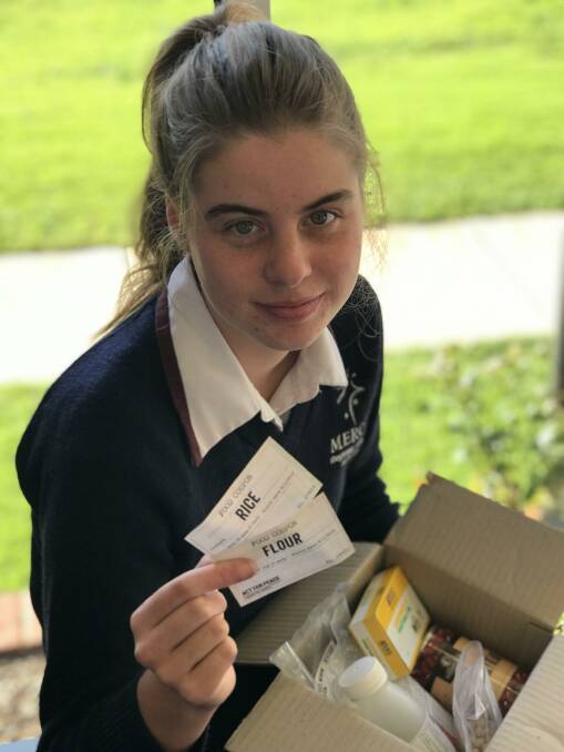 SACRIFICE: Hayley Wason with her week's ration as part of Act For Peace's Ration Challenge.