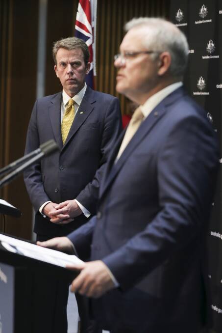 Minister for Education Dan Tehan and Australian Prime Minister Scott Morrison during a press conference on the early childhood education and care relief package. Photo: Alex Ellinghausen