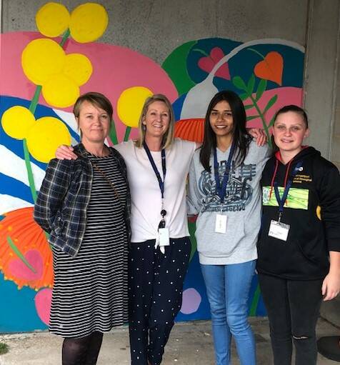 ON SHOW: Artist Megan Nicholson, Brophy youth project worker Bianca OKeefe and participants Lena Wright and Laini Johnson stand in front of their completed mural. Picture: supplied.