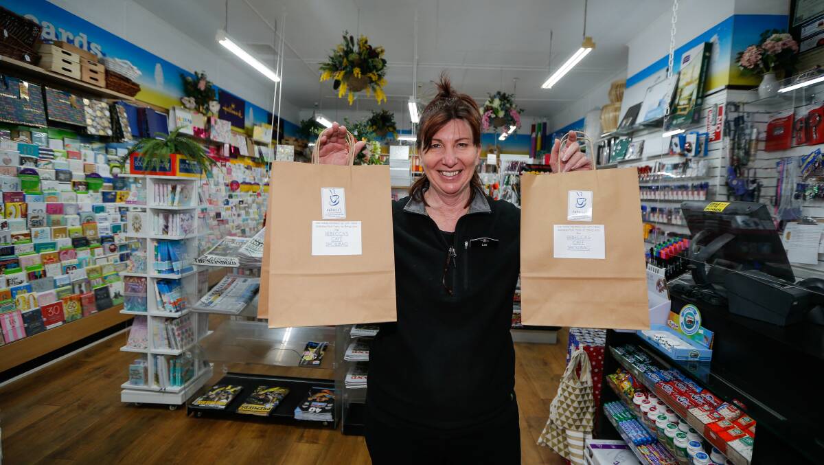 INITIATIVE: Lee Kuprynsky from the Port Fairy Newsagency shows off the showbags which are raising funds for the Port Fairy Show. Picture: Anthony Brady