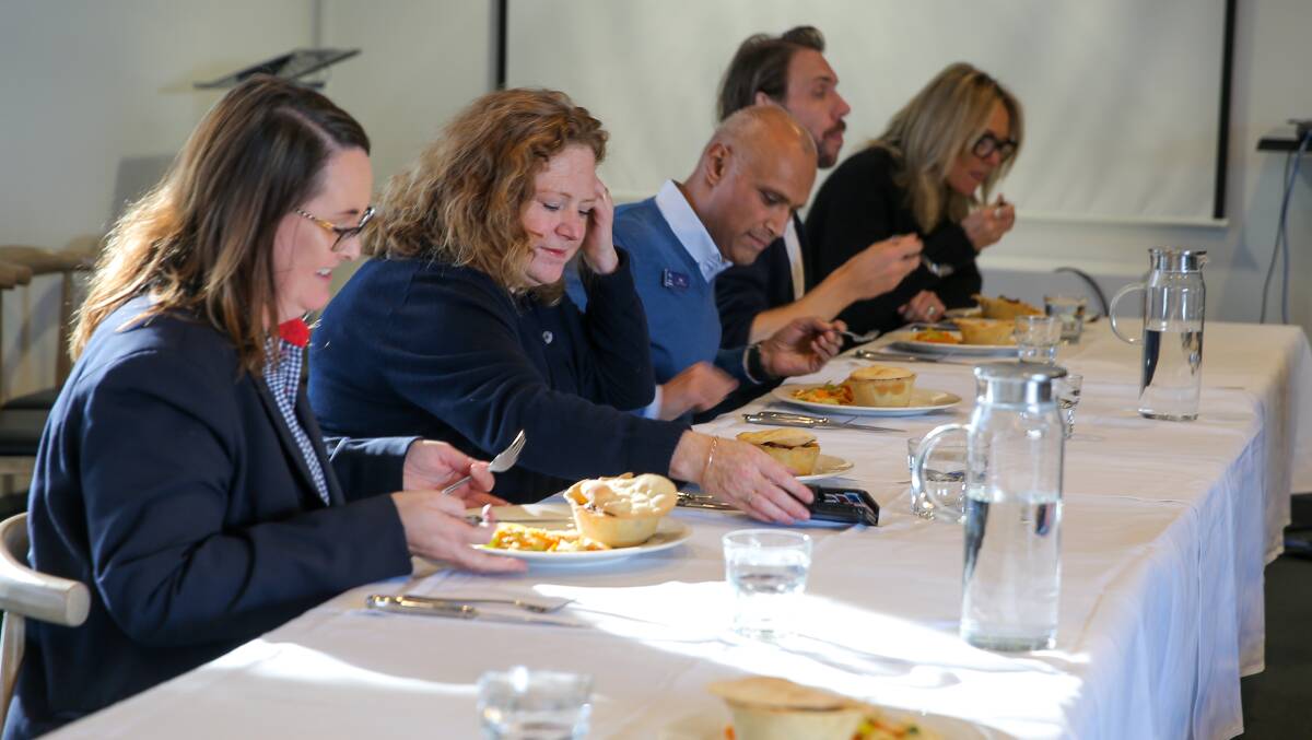 HARD AT WORK: The tasting panel gets started on their first dish, a Moroccan pie. Picture: Rob Gunstone
