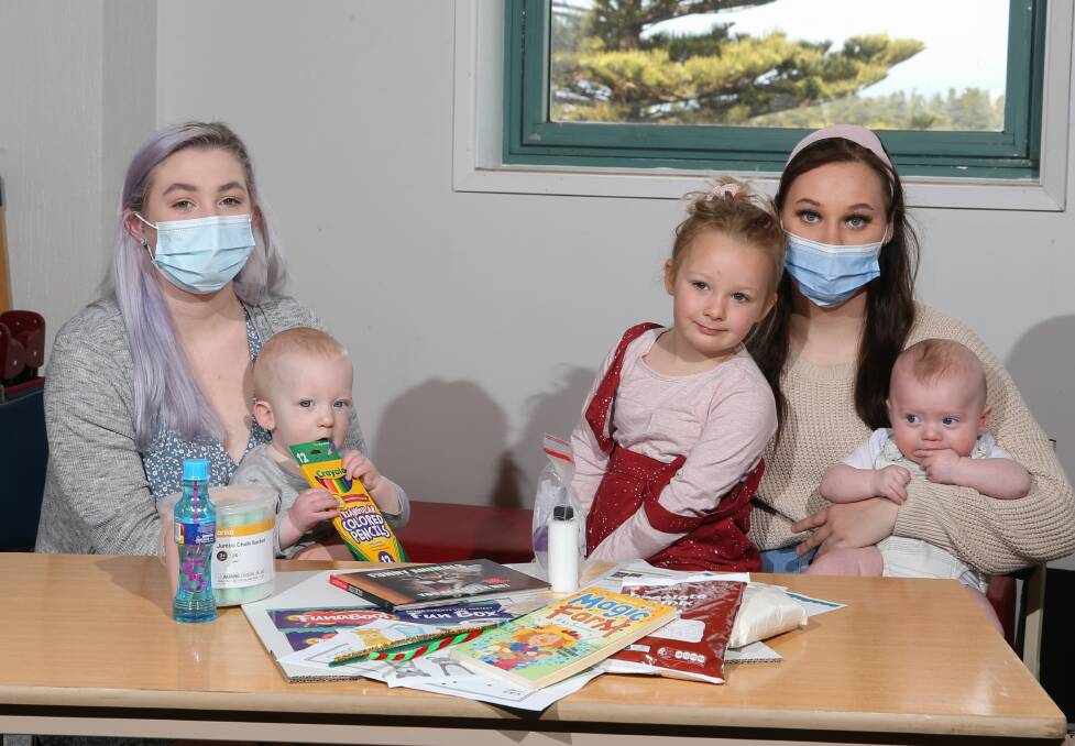 South West TAFE's VCAL Young Parents group Lily Walker with Fox, 8 months, and Rehn Laidlord with Charlotte Walker, 4 and Charlie-Jay Searle, 4 months have put together the Funabool activity boxes. Picture: Mark Witte 