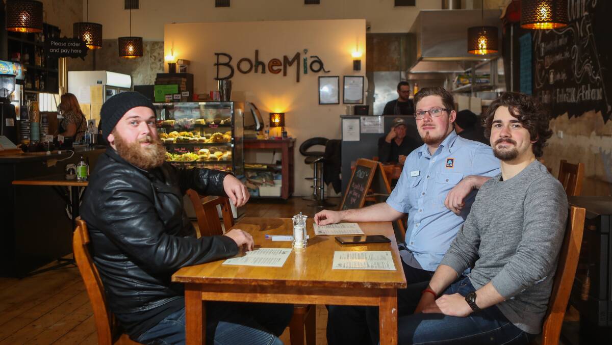 DINE-IN: Pat Rogers, Harry Stokes and Aron Jamison enjoy their lunch at Bohemia. Picture: Morgan Hancock