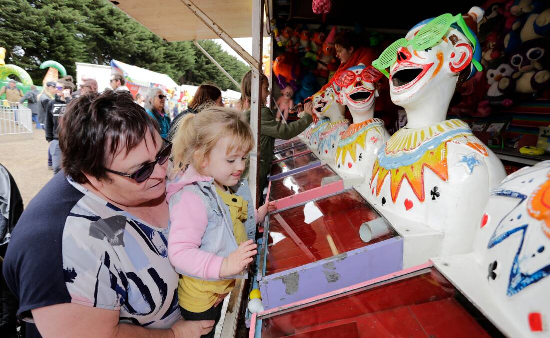 Debbie Brittain helps granddaughter Lilly, 3, play the clown game at the 2019 Noorat Show. Picture: Mark Witte
