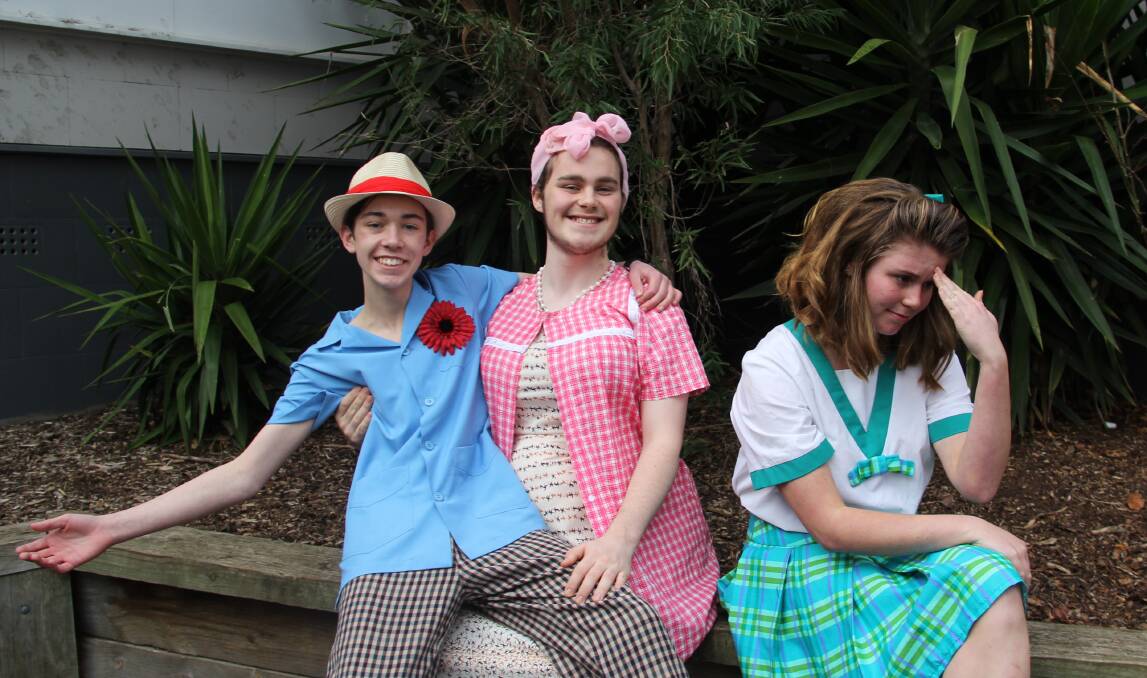 HAIRSPRAY: Year 11 students Neil Phipps as Wilbur Turnblad, Merrick McDonald as Edna Turnblad and Mia Routson as Tracy Turnblad. Picture: Kimberley Price.