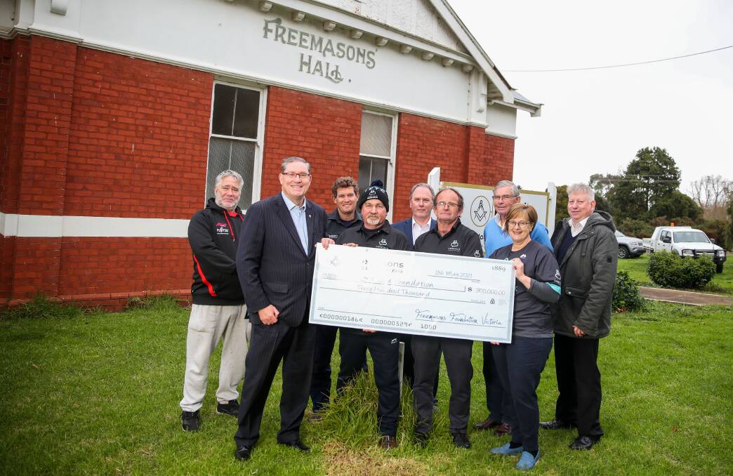 EXPANDING: Members of Let's Talk and the Freemasons with a $300,000 cheque that was donated to the mental health charity. Picture: Morgan Hancock