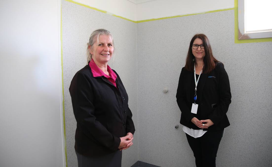 UPGRADES: Anglicare Victoria's Louise Serra and WDEA Works' Andrea Hogan in the recently renovated bathroom. Picture: Mark Witte 