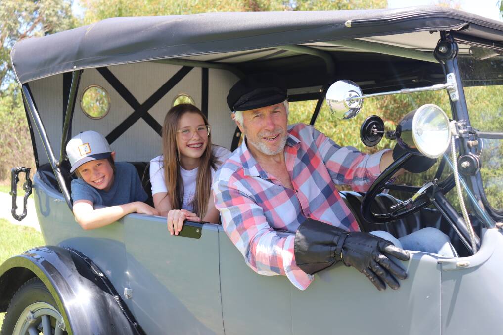 ON SHOW: Murray Murfett driving his 1920 Dodge Brothers tourer with his grandchildren Felix, 11, and Poppy, 13, McDonald. Picture: Kimberley Price