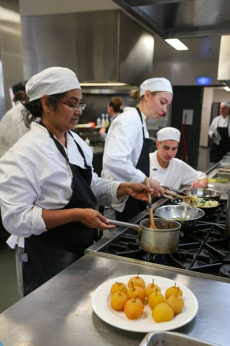SKILLS IN ACTION: South West TAFE cooking students Chamari Ariyadasa, Grace Farrer and Dujon Neoh busy preparing their meals for the Masterchef Challenge. Picture: Rob Gunstone