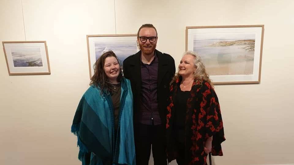 Liam O'Connor with his sister and mother at the opening of his exhibition. 