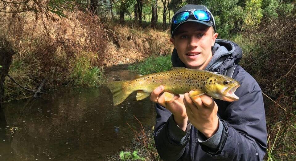 SUPER: Xavier Ellul with a wild brown trout. Remember to send your pictures in to fishing@richardsonmarine.com.au