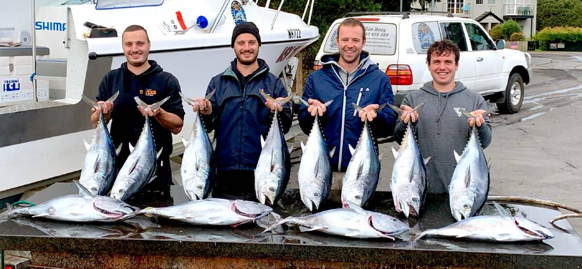 HAPPY DAYS: The Salty Dog Charters crew with a bag of tuna their clients caught on the weekend ... the smaller school tuna have worked their way closer inshore. Send your pictures in to fishing@richardsonmarine.com.au