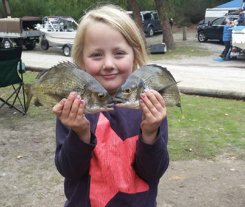 PUMPED: Indigo Treloar with a couple of bream from the Glenelg River. She beat all the adults and took out the junior section with 10 fish for 4.84kg. You can submit your pictures by emailing fishing@richardsonmarine.com.au