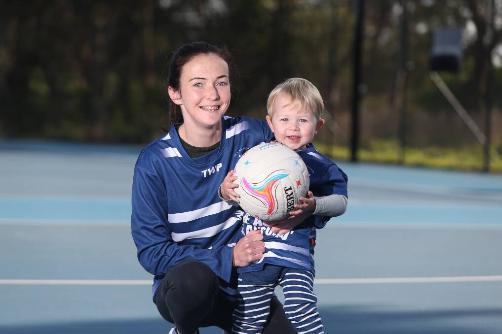 FAMILY AFFAIR: Allansford senior netball coach Bridget Foster, pictured with son Max, 2, has a deep passion for community sport. Picture: Mark Witte