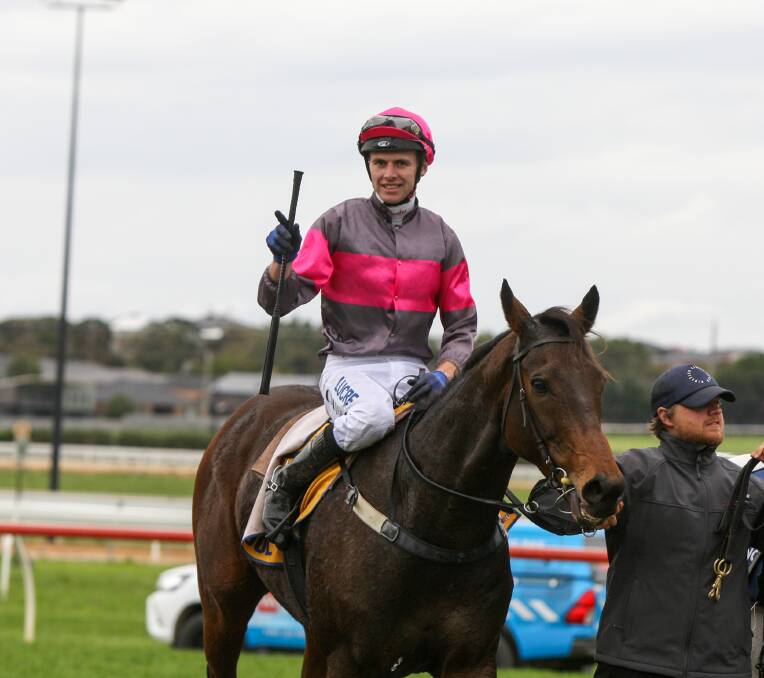 SENSATIONAL: Jockey Clayton Douglas salutes after riding Gold Medals to victory in the 2018 Grand Annual Steeplechase. Picture: Rob Gunstone