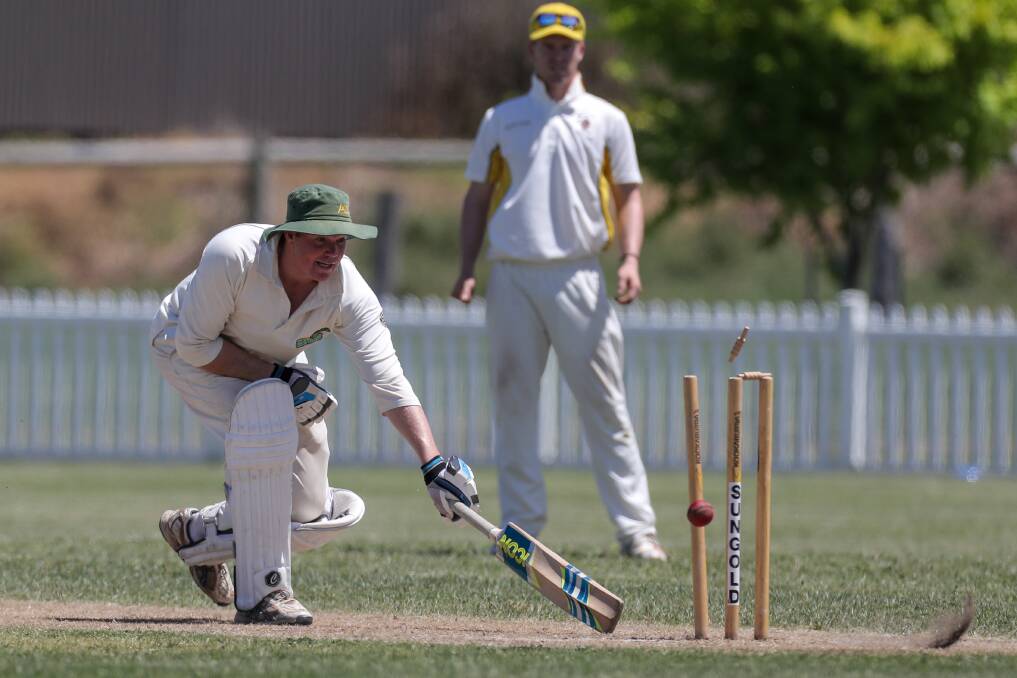 MANY HATS: Playing cricket for Allansford, Chris Bant makes his ground as a quick return hits the stumps. Picture: Rob Gunstone