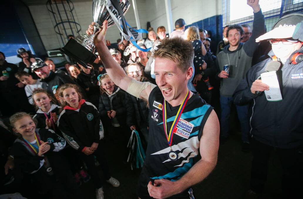 HAPPY DAY: Ben Walsh walks into the Kolora-Noorat clubrooms holding the premiership cup back in 2017. Picture: Morgan Hancock