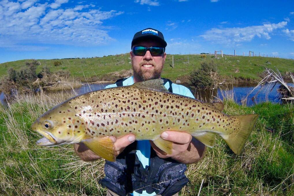 ON THE FLY: Scott Gray was pretty happy to land this trout while fishing on the Hopkins River. The river has been fishing pretty well in recent times, with reports of a number of fishos enjoying success. Picture: Supplied