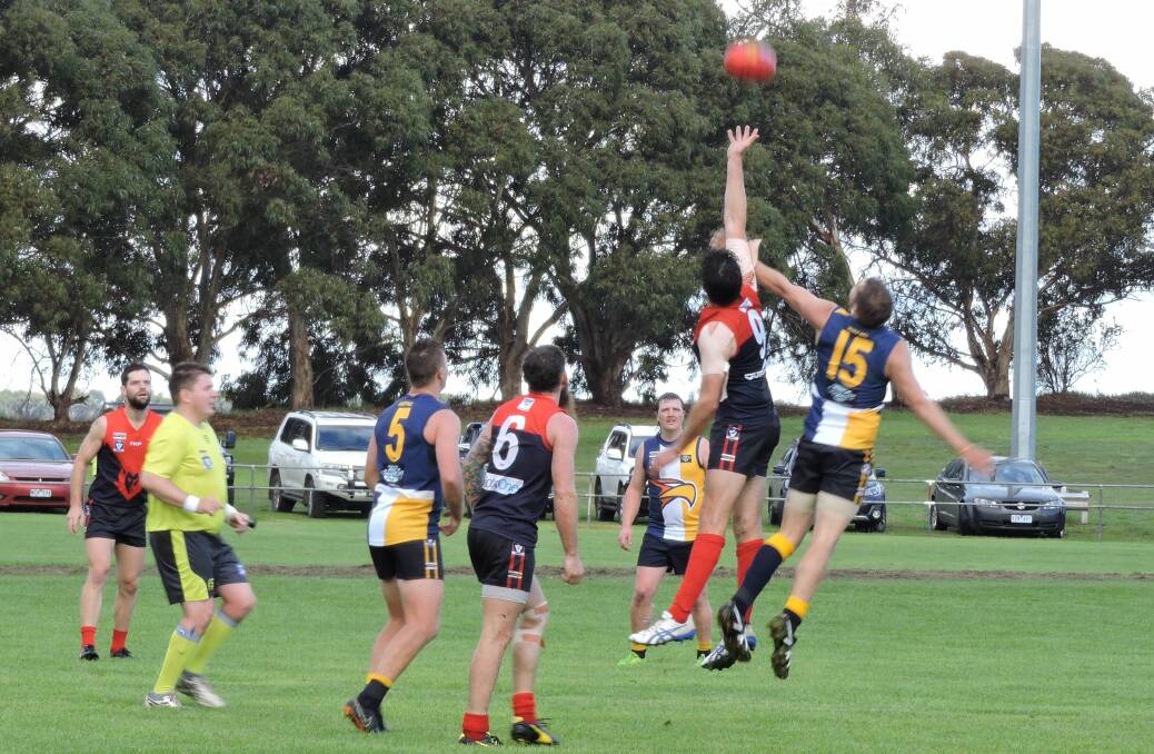BATTLE OF BIGS: Hawkesdale Macarthur's players fought hard in Saturday's 23-point loss to Lismore Derrinallum. Picture: Supplied