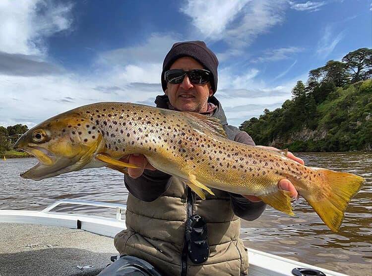 SENSATIONAL EFFORT: Michael Malone was pretty happy with himself after nabbing a surprise Hopkins trout from the estuary. Picture: Supplied
