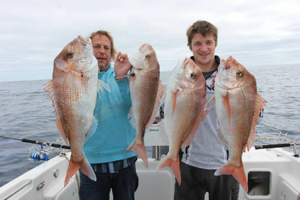 NICE WORK: Tyson and Barry Osborne show off a set of thumping snapper they caught off Port Fairy.