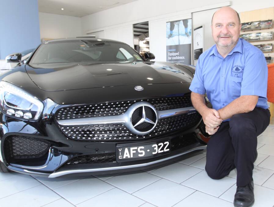 Service with a smile: Callaghan Motors service manager Rob Lee has won a national award to visit the home of Mercedes Benz in Germany.