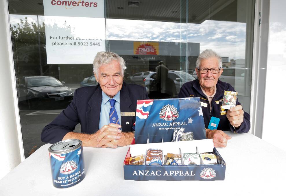 Appeal: RSL members Clive Hewett and Bob Frost sell ANZAC Day badges in Warrnambool. Picture: Anthony Brady