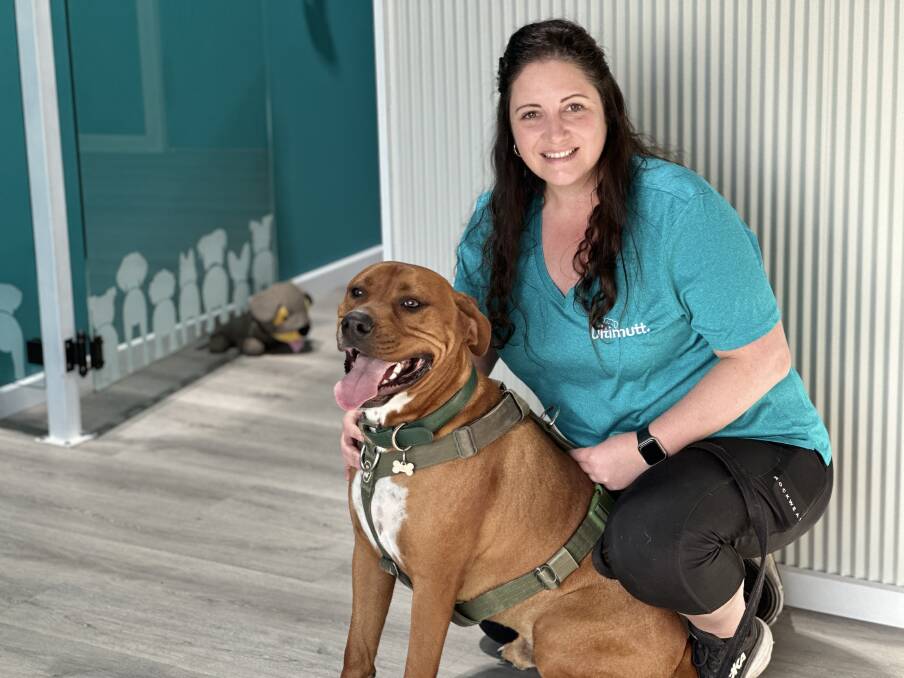Bec Gould, with her dog Reggie, has opened her own doggie day care in Warrnambool called Ultimutt. Picture by Katrina Lovell 