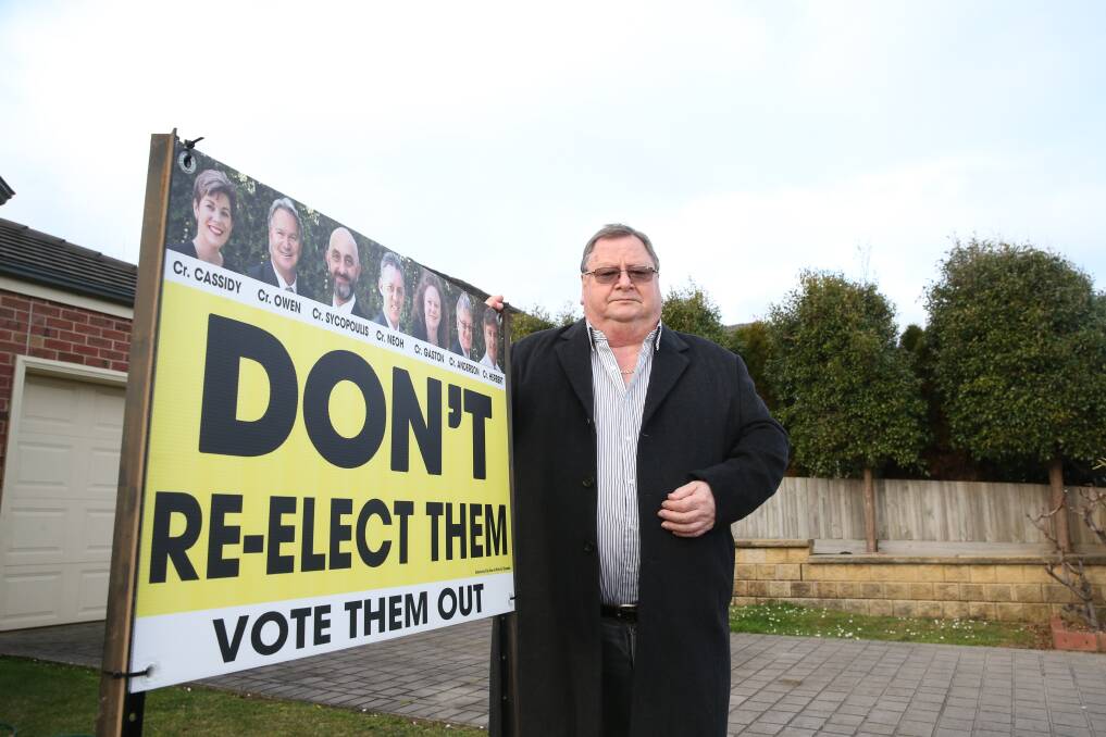 Election mode: Warrnambool Ratepayers Association president Brian Kelson has put up signs in his front yard calling all seven councillors to be voted out. Picture: Mark Witte 