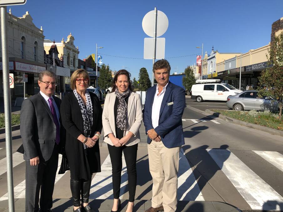 Warrnambool council CEO Peter Schneider, business owner Debbie Arnott, MP Jaclyn Symes and mayor Tony Herbert.