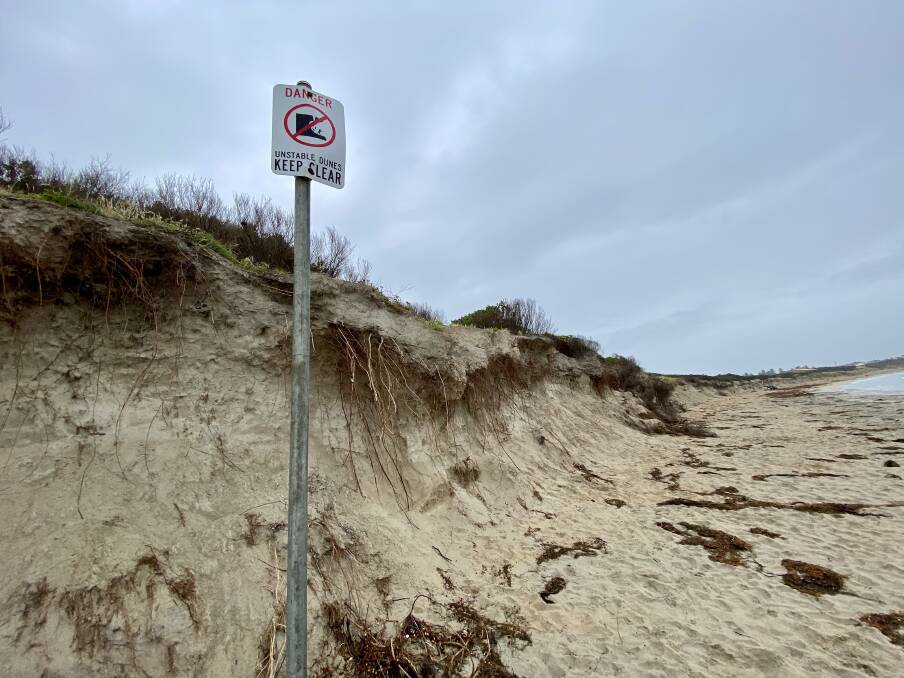 Danger: Warning signs have been erected along the main beach to alert beach users to the danger of the sand cliffs, but a member of the public has raised the alarm with councillors.