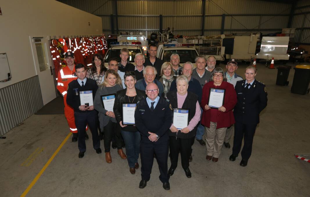 The SES volunteers who were awarded either National Medals or long-service certificates for their years of work.